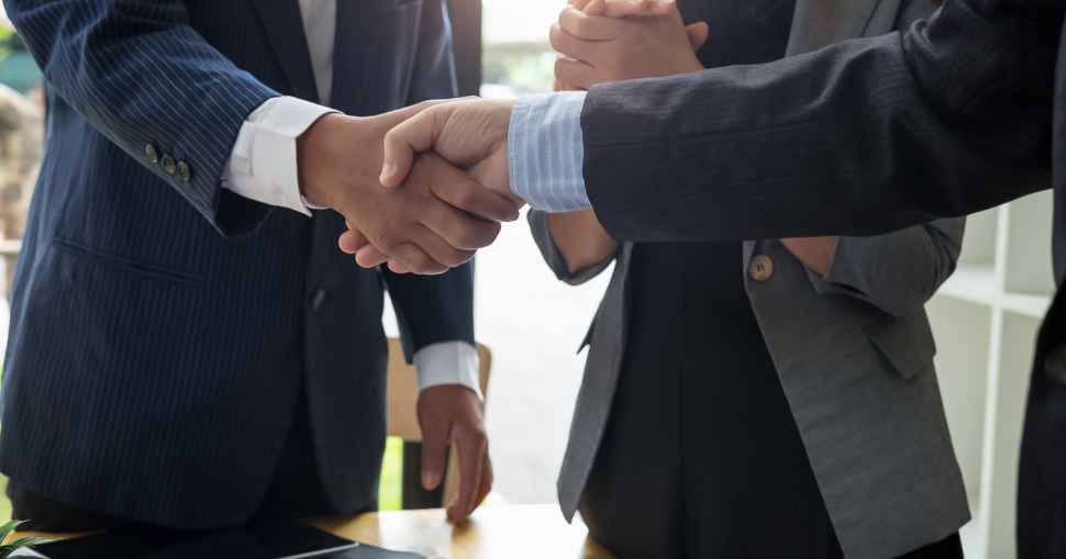 Photograph of business people shaking hands